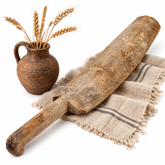 Antique Swedish wooden scutching knife styled with wheat as rustic farmhouse decor