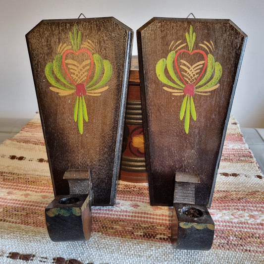 Vintage Hand-Painted Swedish Candle Sconces: Rustic Nordic Folk Art Pair with green and red floral motifs on dark wood