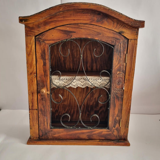 Antique Rustic Wood Wall Cabinet with Iron Door: Farmhouse Kitchen Storage featuring decorative metal scrollwork and lace shelf lining.