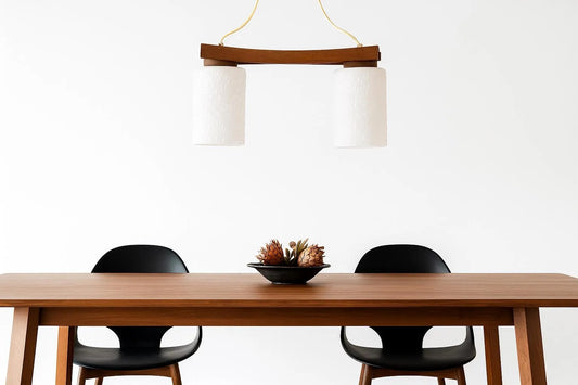 Scandinavian Mid-Century Teak Pendant Lamp – Frosted Glass Shades Chandelier above minimalist teak table with black chairs, timeless charm