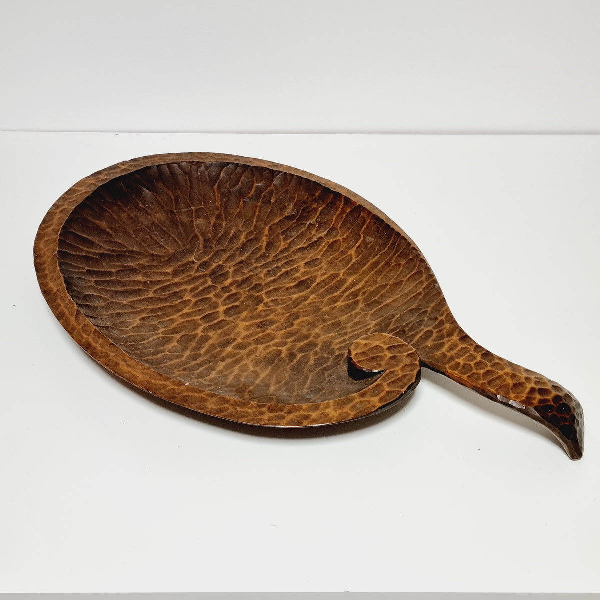 Gouge carved wooden dish with long curved handle