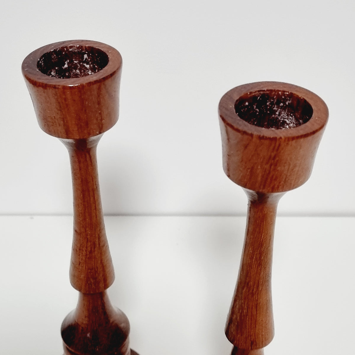 Tulip-shaped candle cups of vintage wooden candlesticks