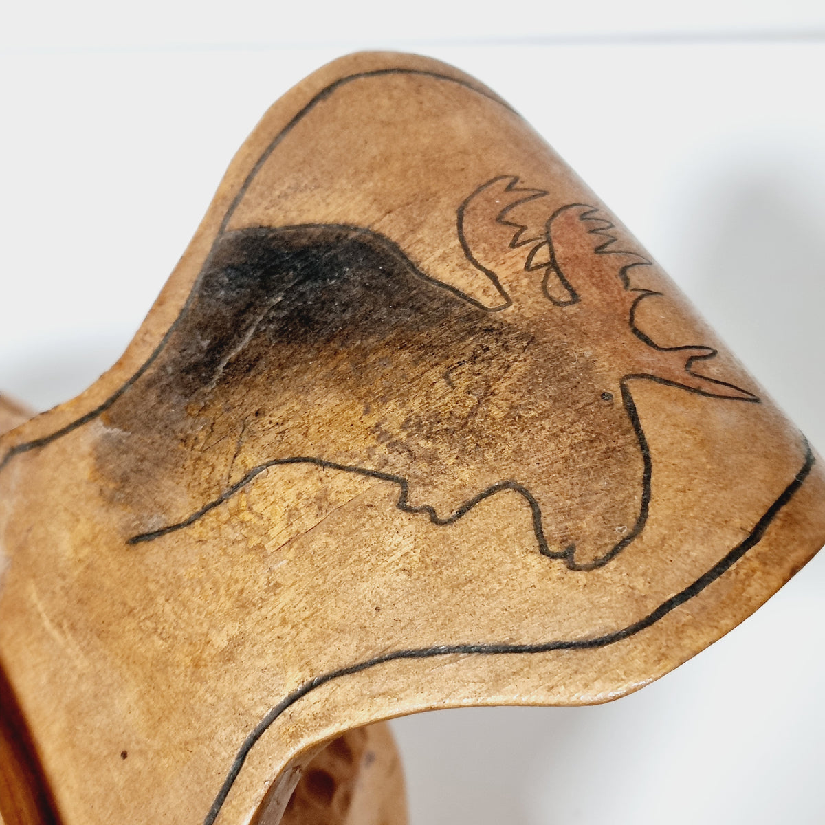 Wood-burned moose head on the handle of birch burl bowl