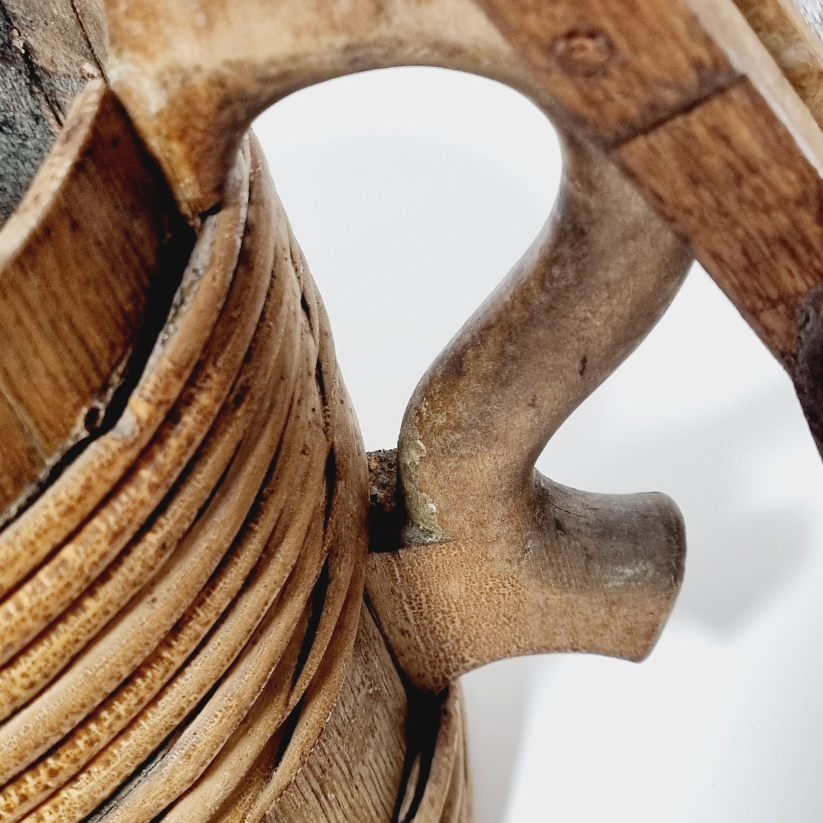 S-shaped carved handle worn smooth on antique wooden tankard