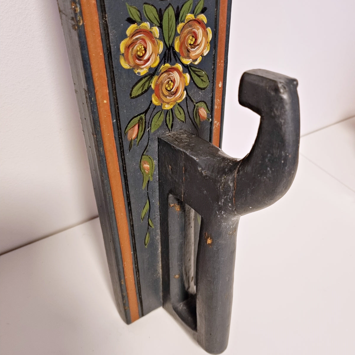 Carved wooden hook and painted rose bouquet on antique Swedish wall hook