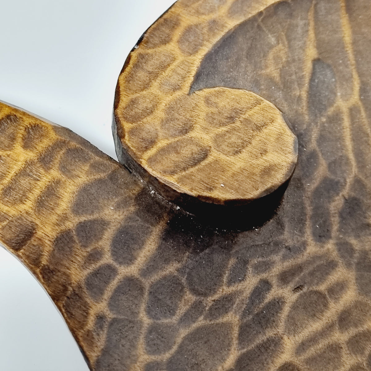 Close-up of gouge carved texture inside Scandinavian wooden dish