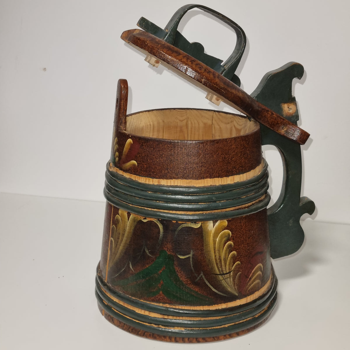 Hand painted yellow, green and red acanthus scrolls on wooden tankard
