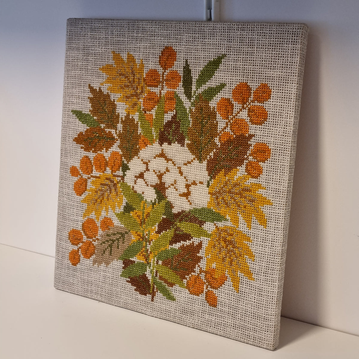 Swedish floral cross stitch wall art with golden flowers and orange berries – photo 3