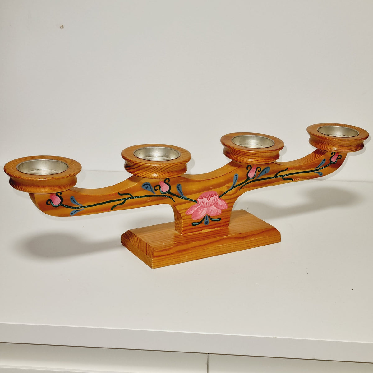 Hand painted rose vine on Swedish pine advent candelabra, angled view