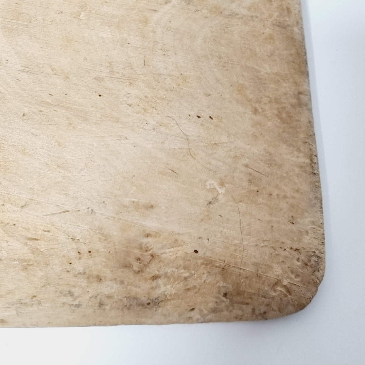 Close-up of the worn wooden surface of the antique Swedish scoop