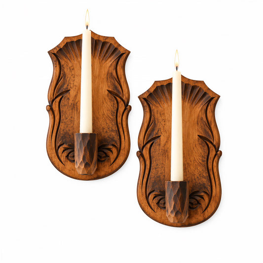 two wooden candle holders with lit candles, mounted on a white background.