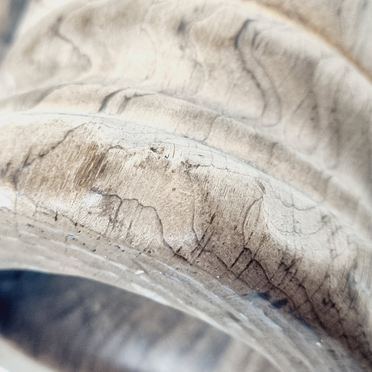 Close-up of figured wood grain on carved tankard rim