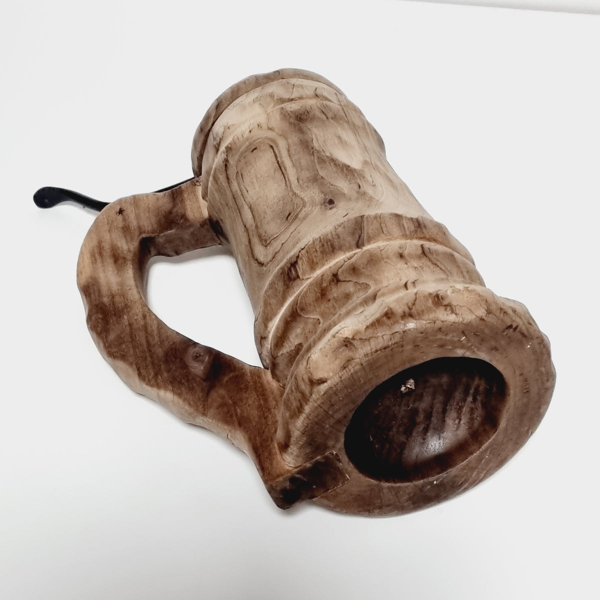 Hollowed base of hand carved wooden tankard