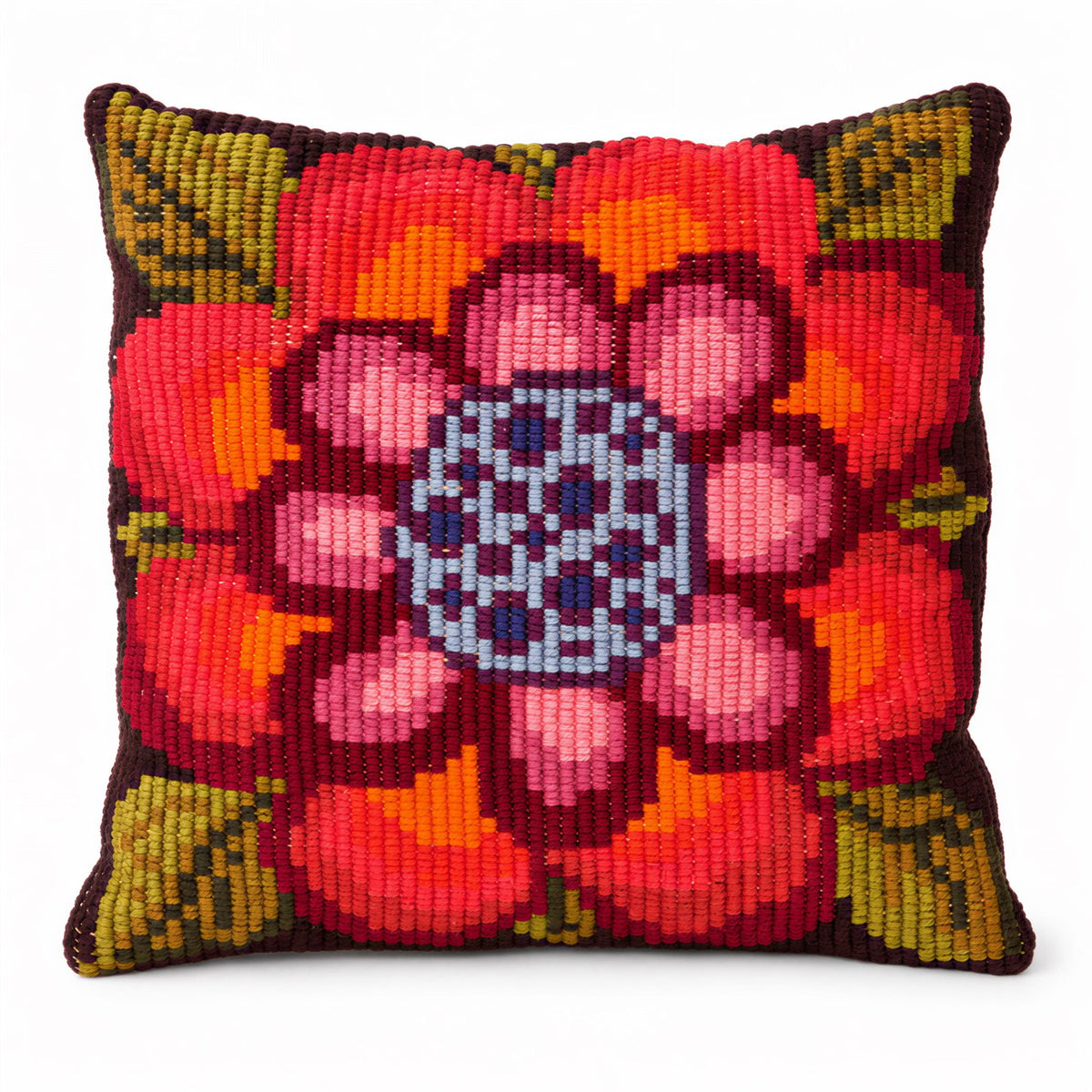 A colorful, hand-stitched pillow featuring a large, vibrant flower design with a blue center.