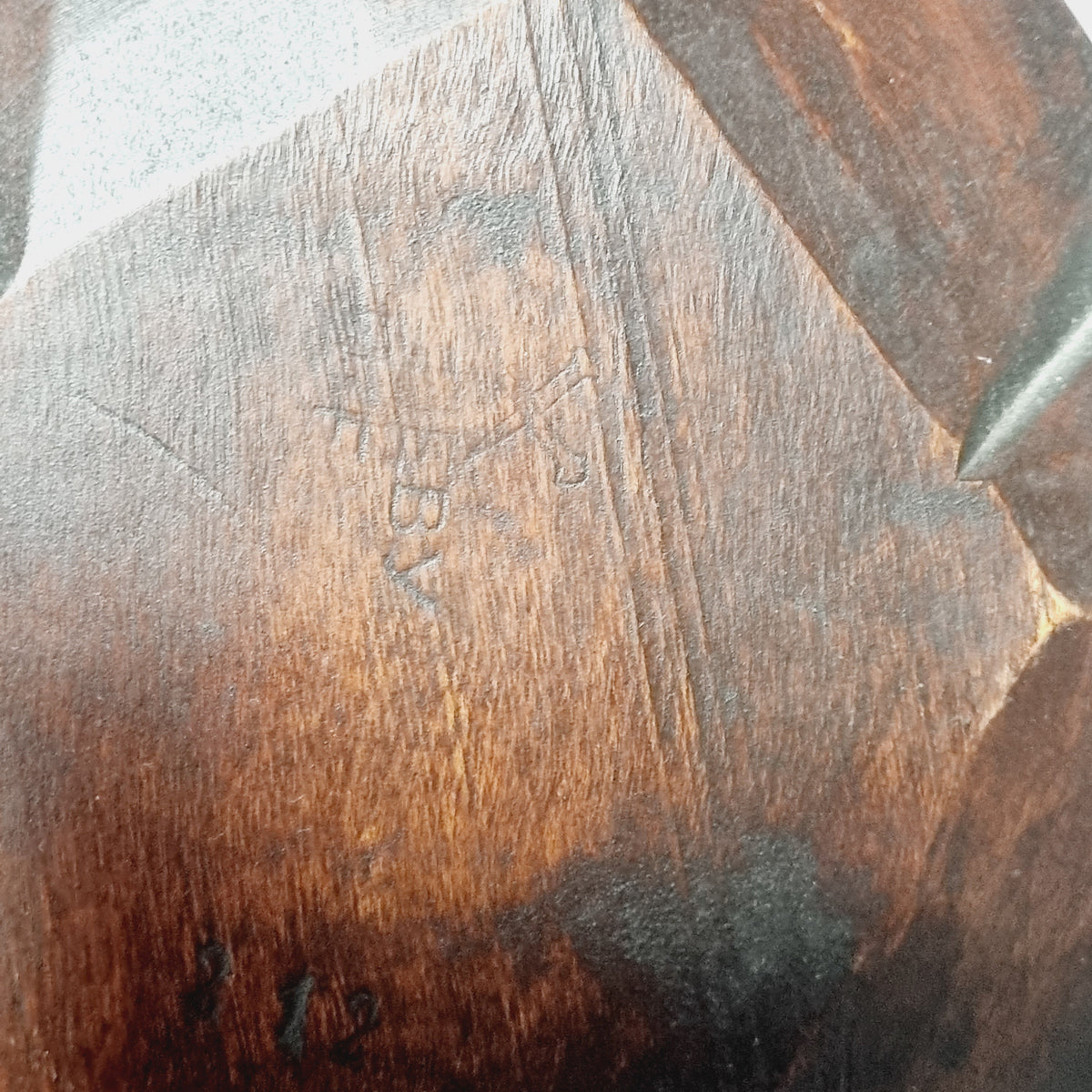 Close-up of Steneby workshop stamp on wooden wall sconce