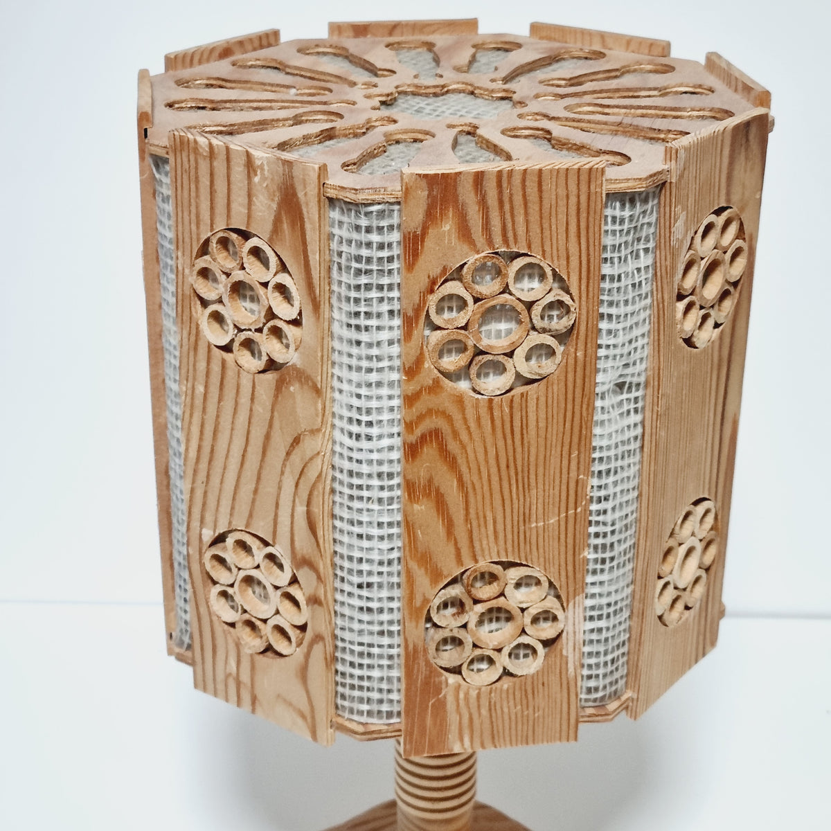 a wooden lamp with a unique, intricate design.