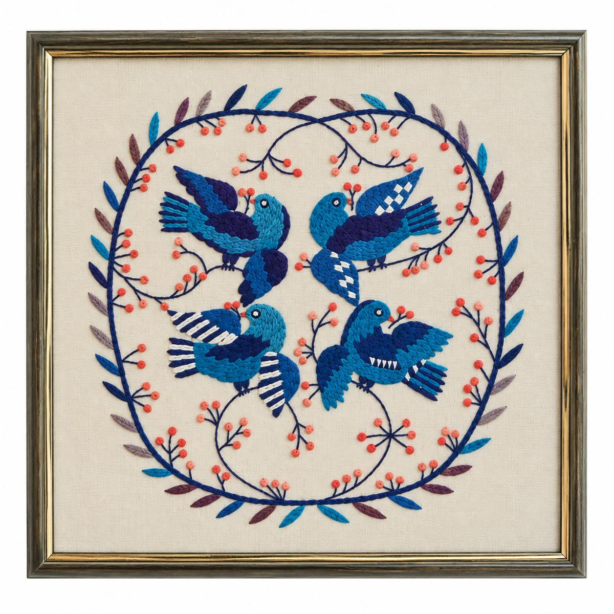 Framed Swedish Blekingesöm embroidery of four blue birds on linen