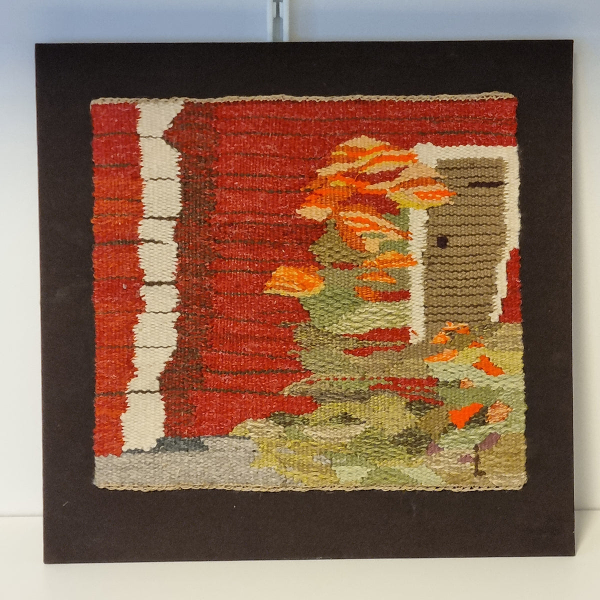 Swedish handwoven tapestry of a red cottage with orange flowers – photo 4
