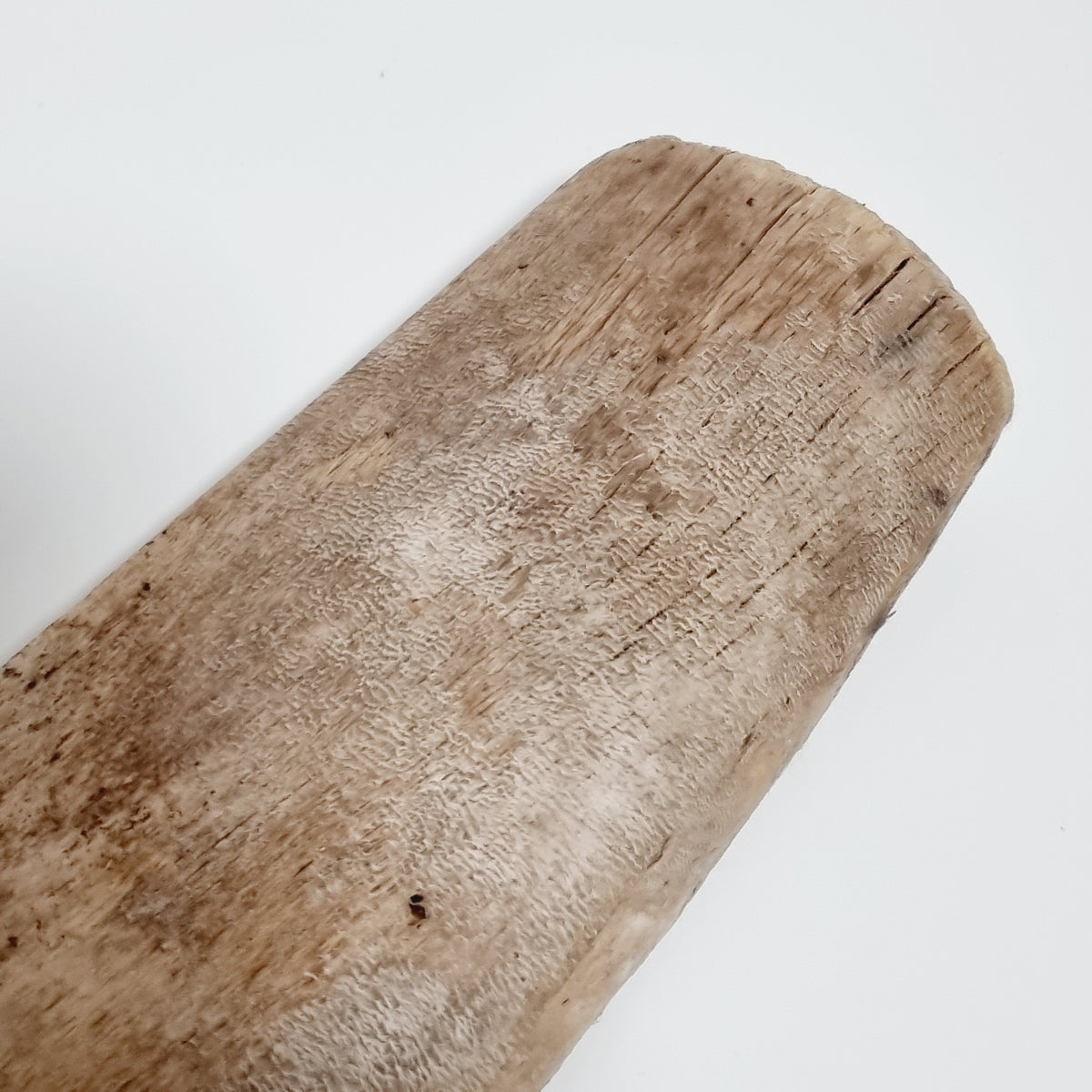 Close-up of the raised, textured wood grain on the antique Swedish skäkta