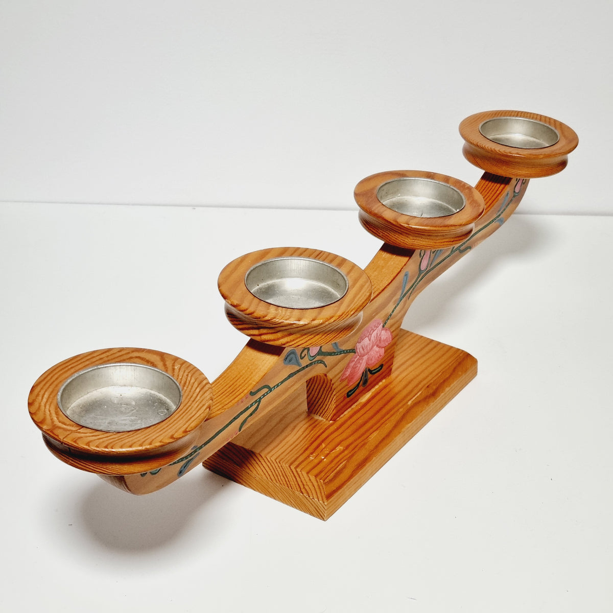 Turned candle cups with metal inserts on Swedish advent candle holder
