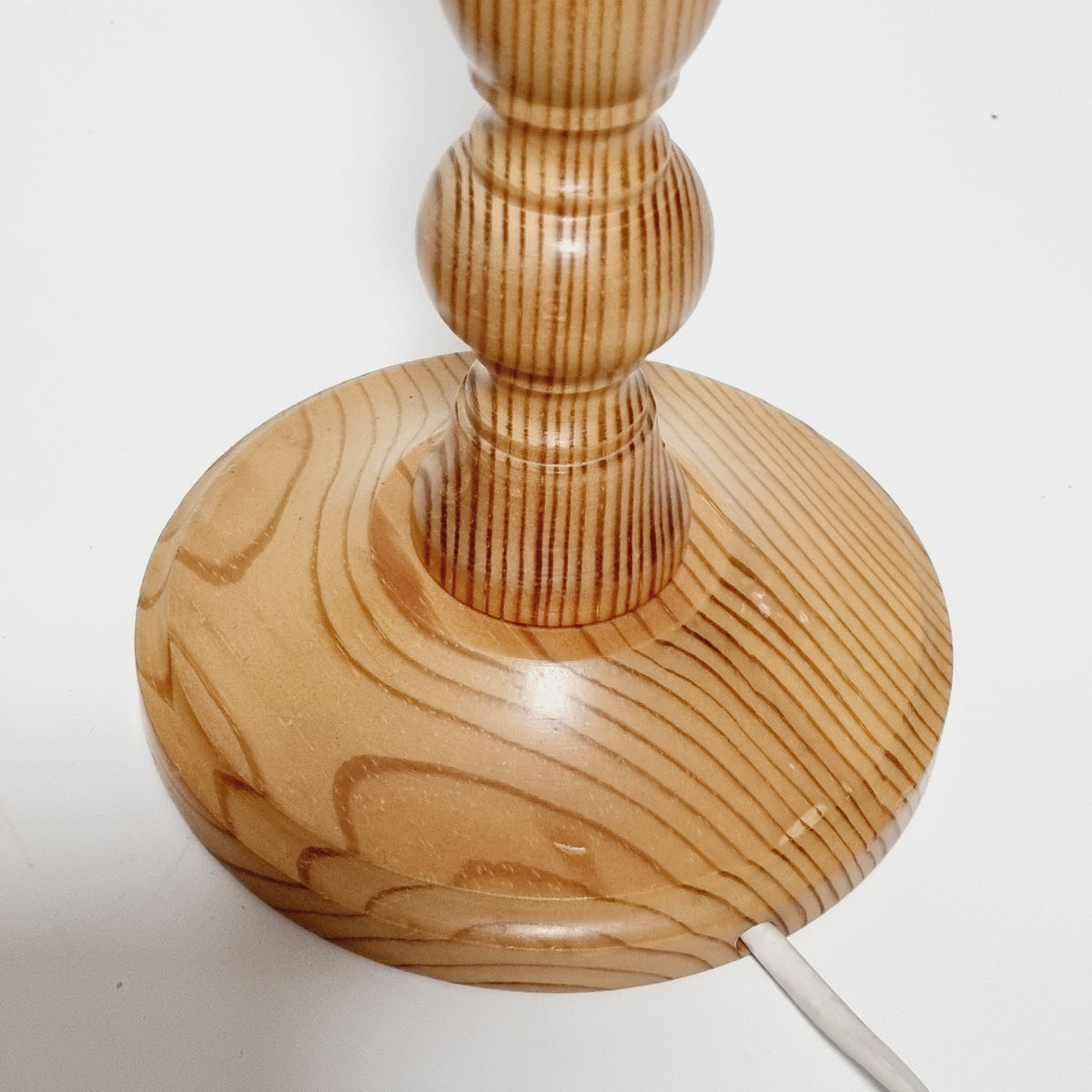 Amber pine grain detail on vintage Swedish lamp base