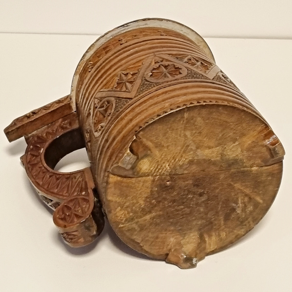 Antique Scandinavian chip carved tankard viewed from the handle side