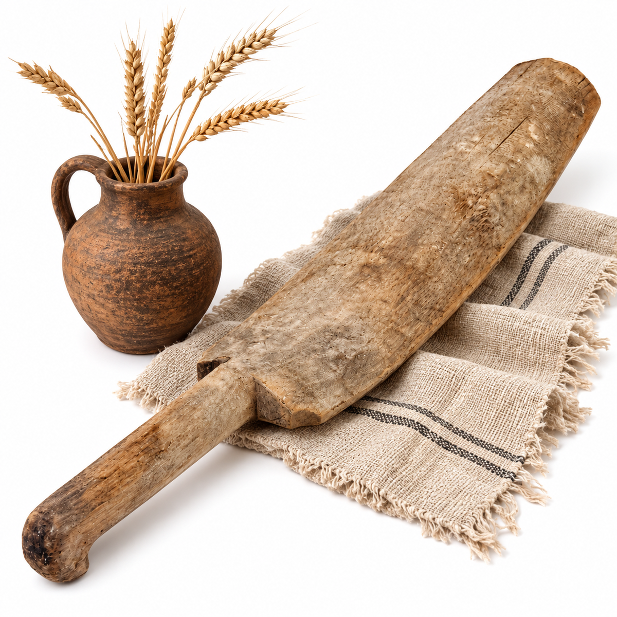 Antique Swedish wooden scutching knife styled with wheat as rustic farmhouse decor