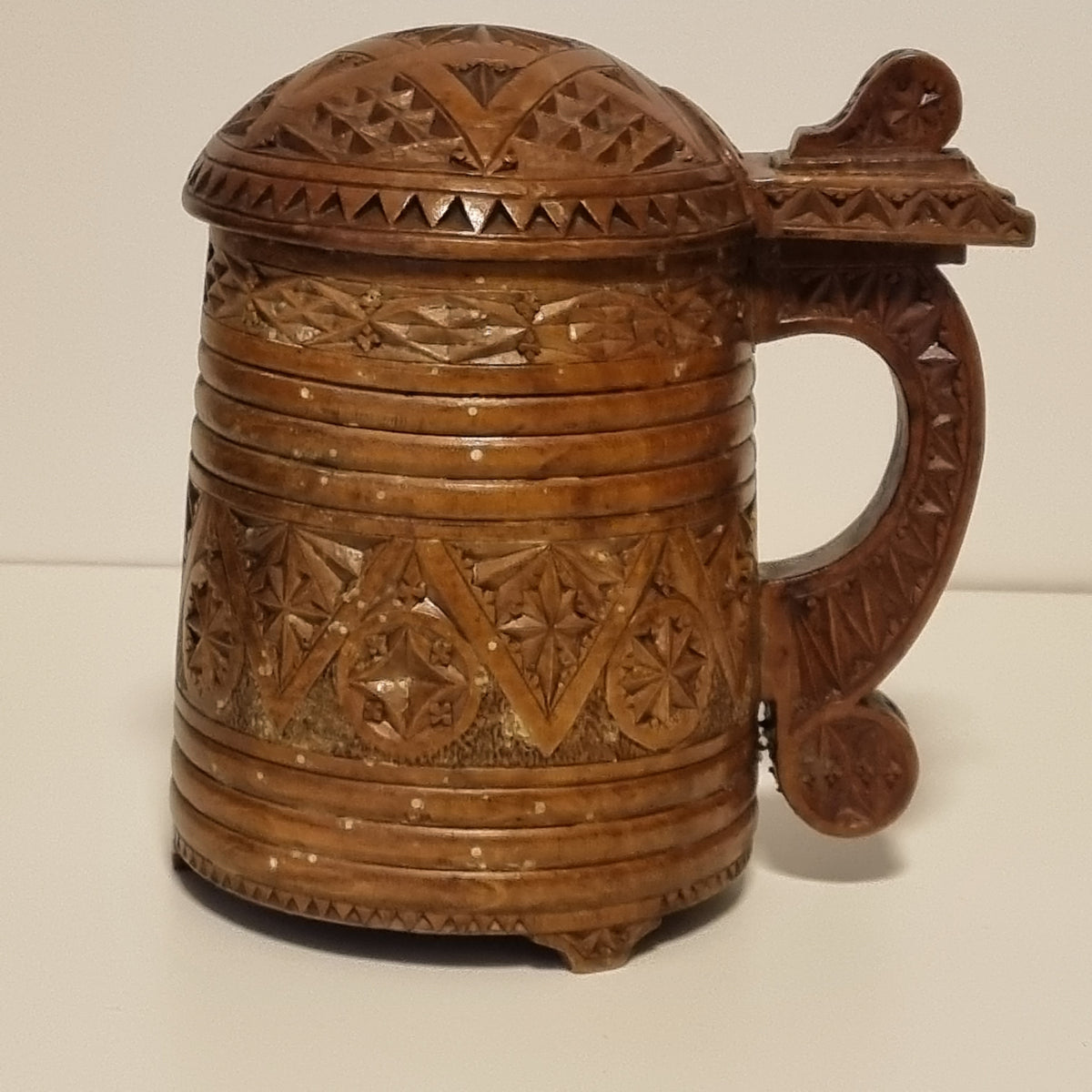 Chip carved wooden tankard with carved scroll handle, Scandinavian folk art