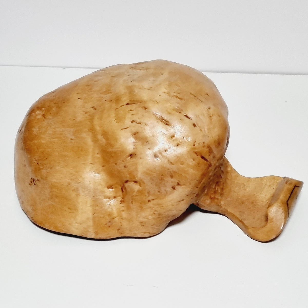 Close-up of masur birch burl grain on carved bowl