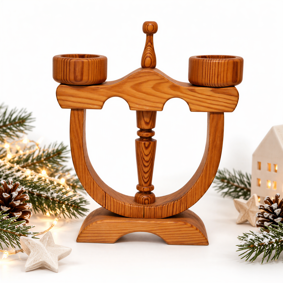 Stig Johnsson pine candle holder styled with pine branches and pine cones