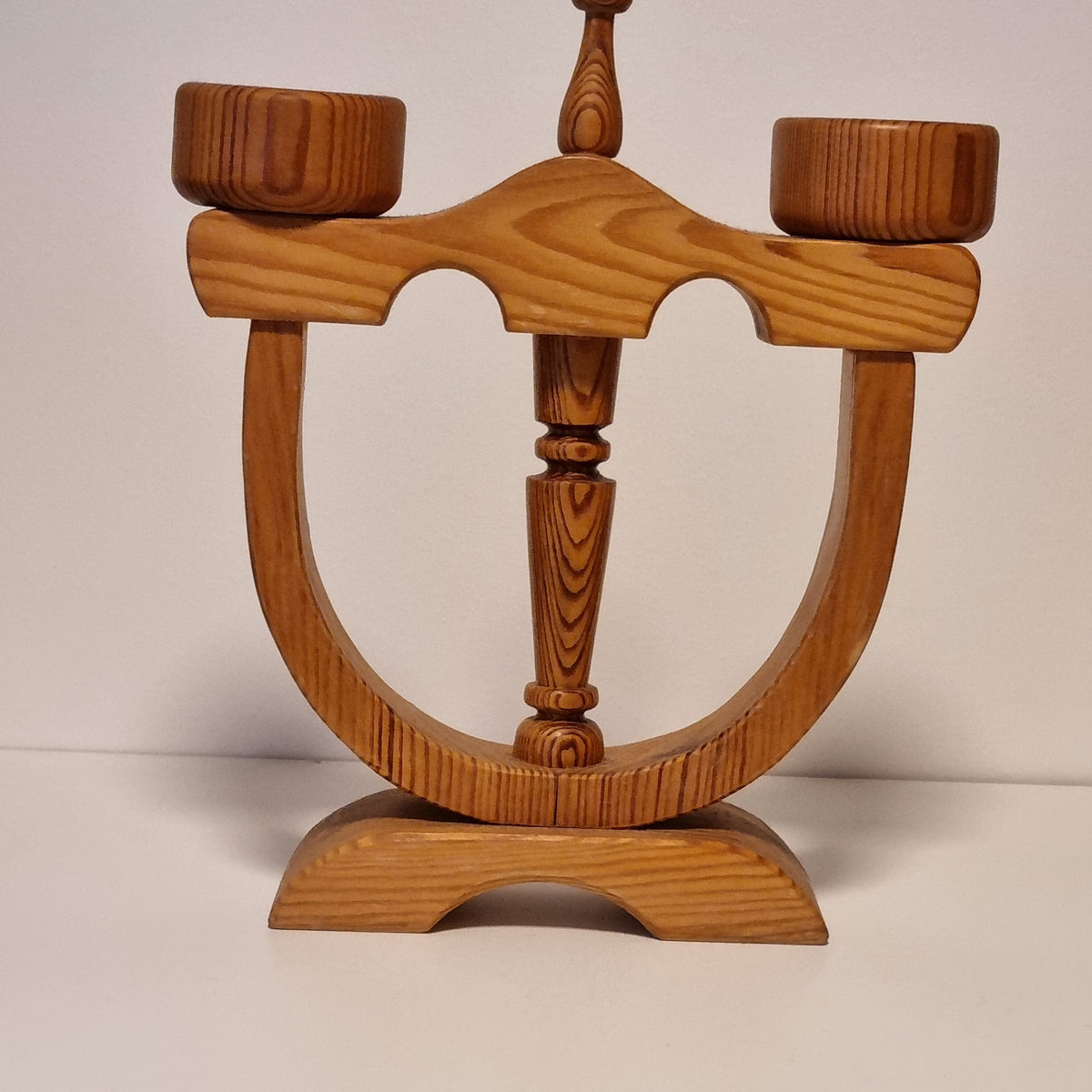 Vintage Swedish two-arm pine candelabra, angled view