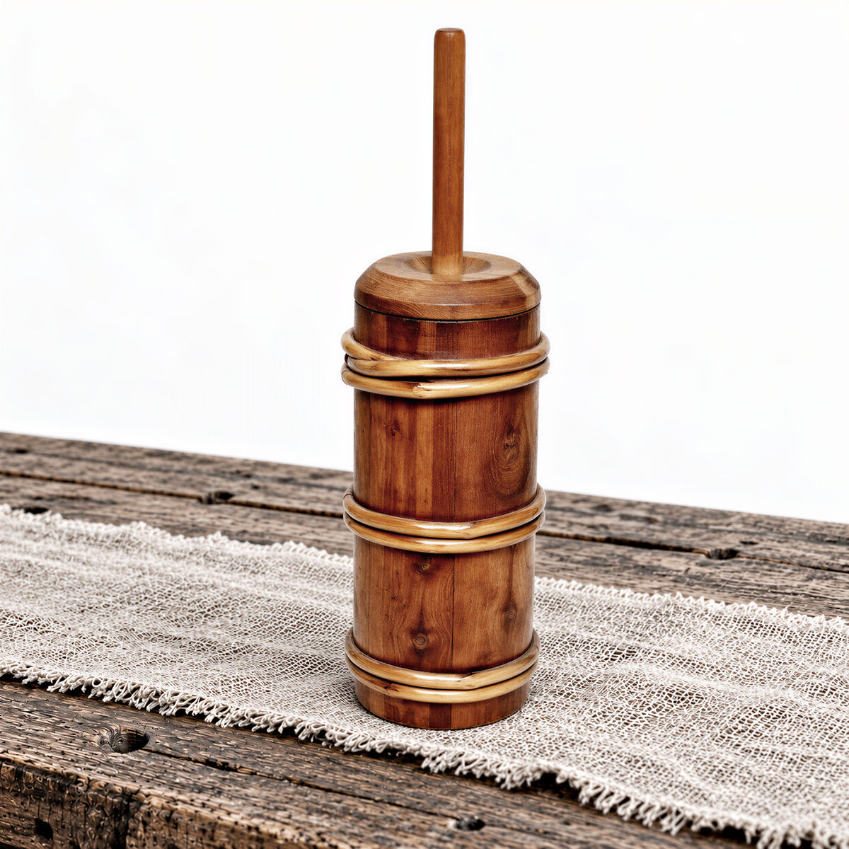 Small staved butter churn styled on a table