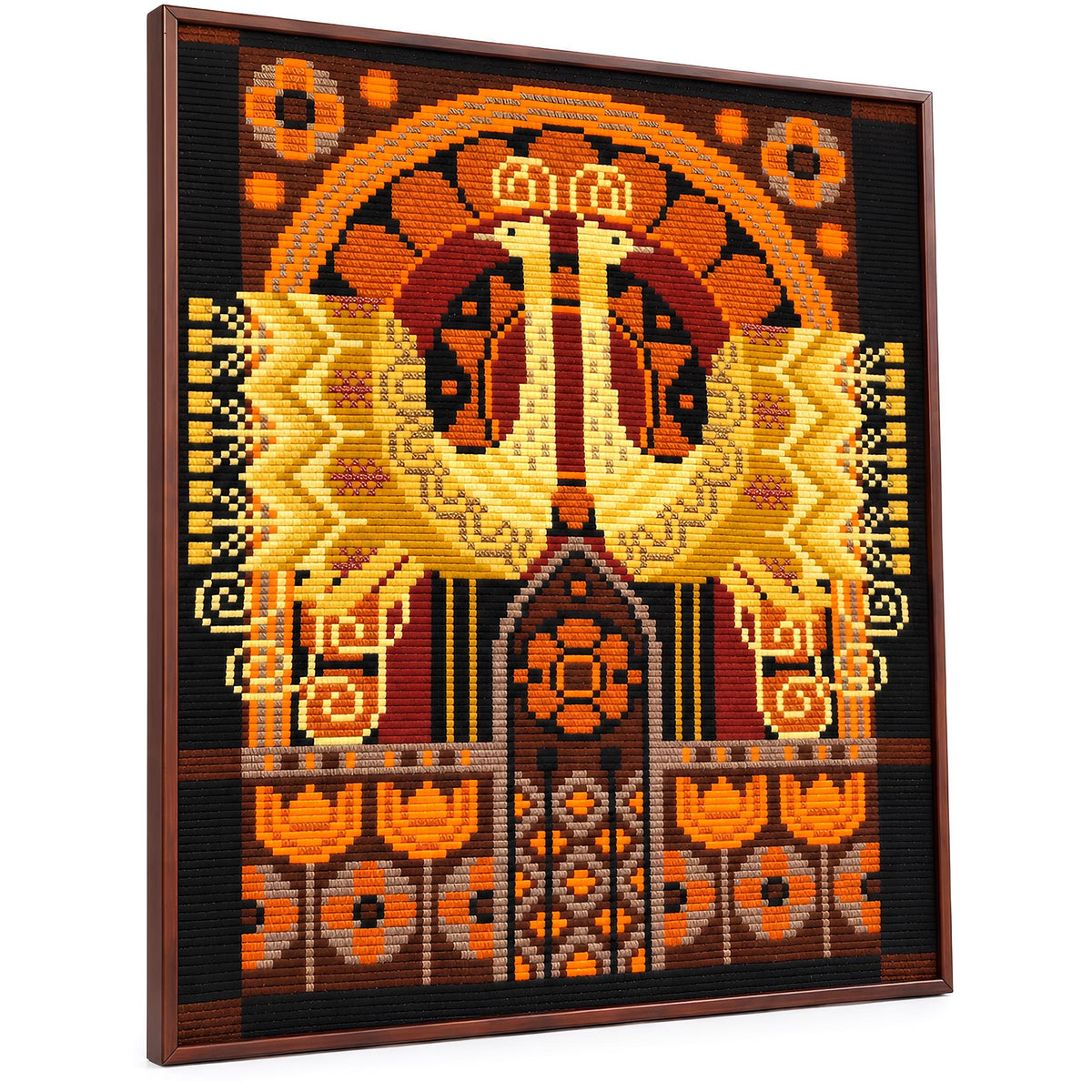 The image is a framed embroidered or cross-stitched artwork featuring a vibrant, intricate design with a variety of colors and patterns.