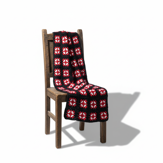 Vintage Crochet Granny Square Blanket: Handmade Wool Throw, Retro Boho Decor draped over rustic wooden chair in bright light