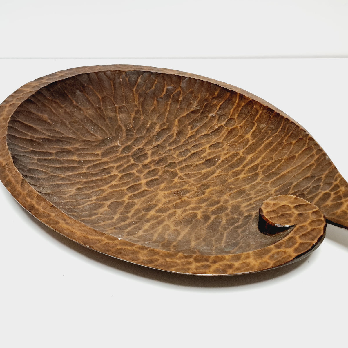 Hand carved wooden leaf dish, side view