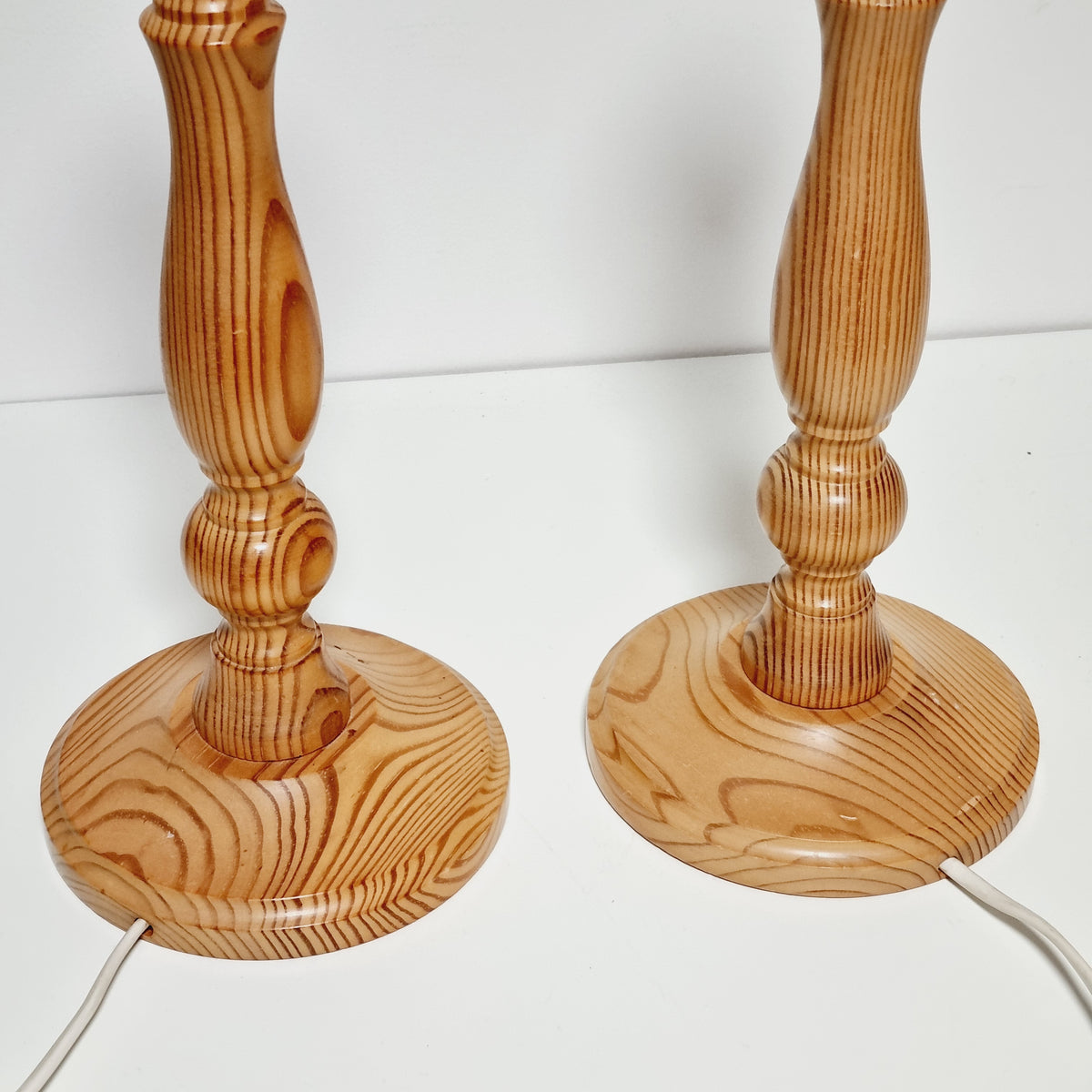 Turned pine stems of vintage Swedish table lamp pair