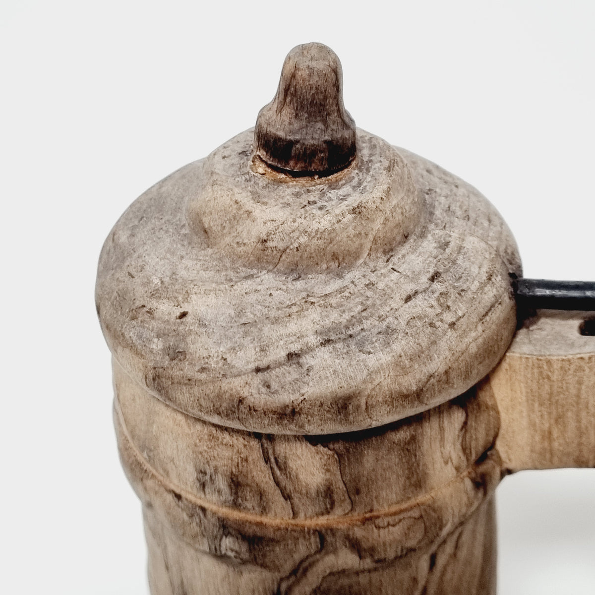 Domed lid with carved knob on wooden tankard