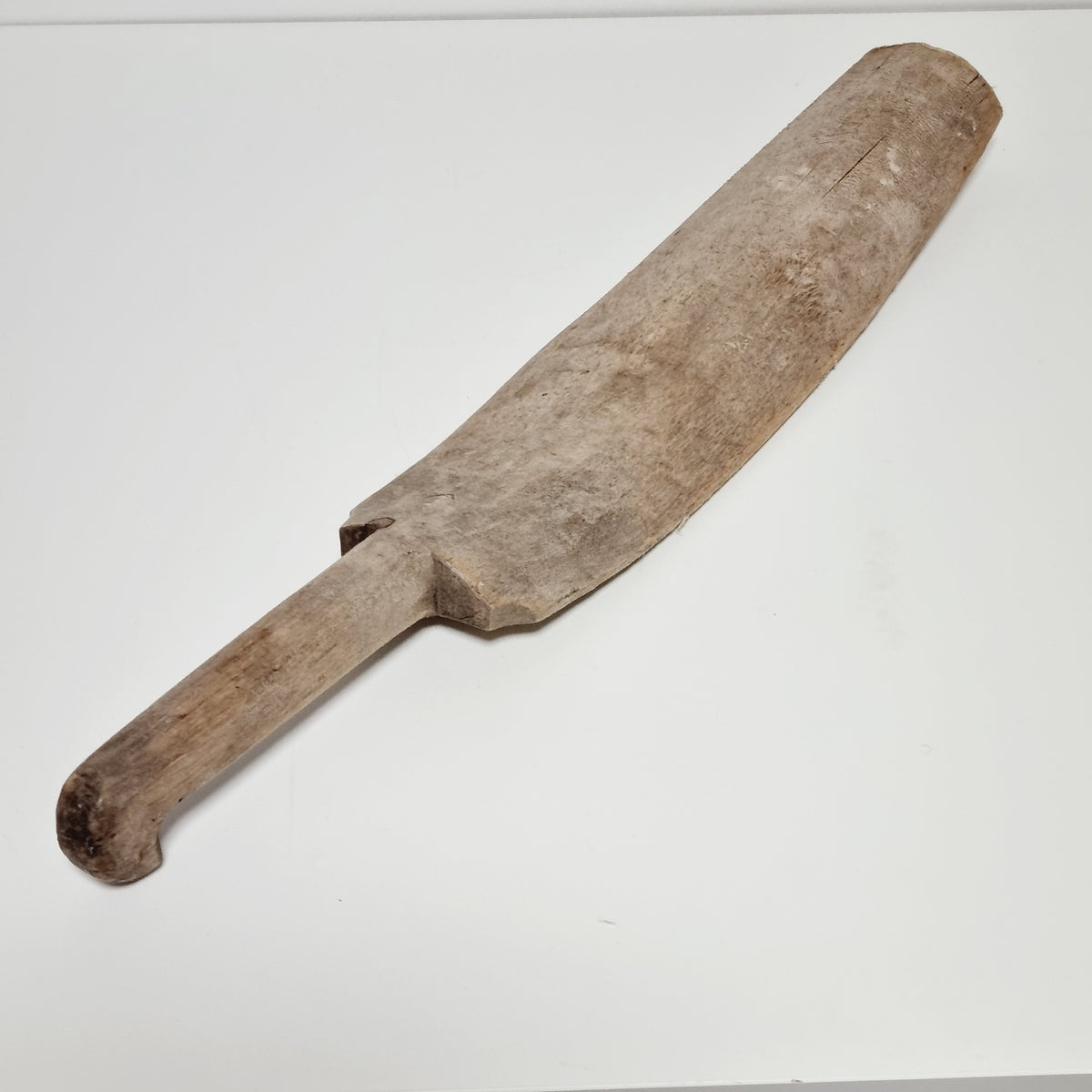 Side view of the weathered antique flax scutching knife with hooked handle