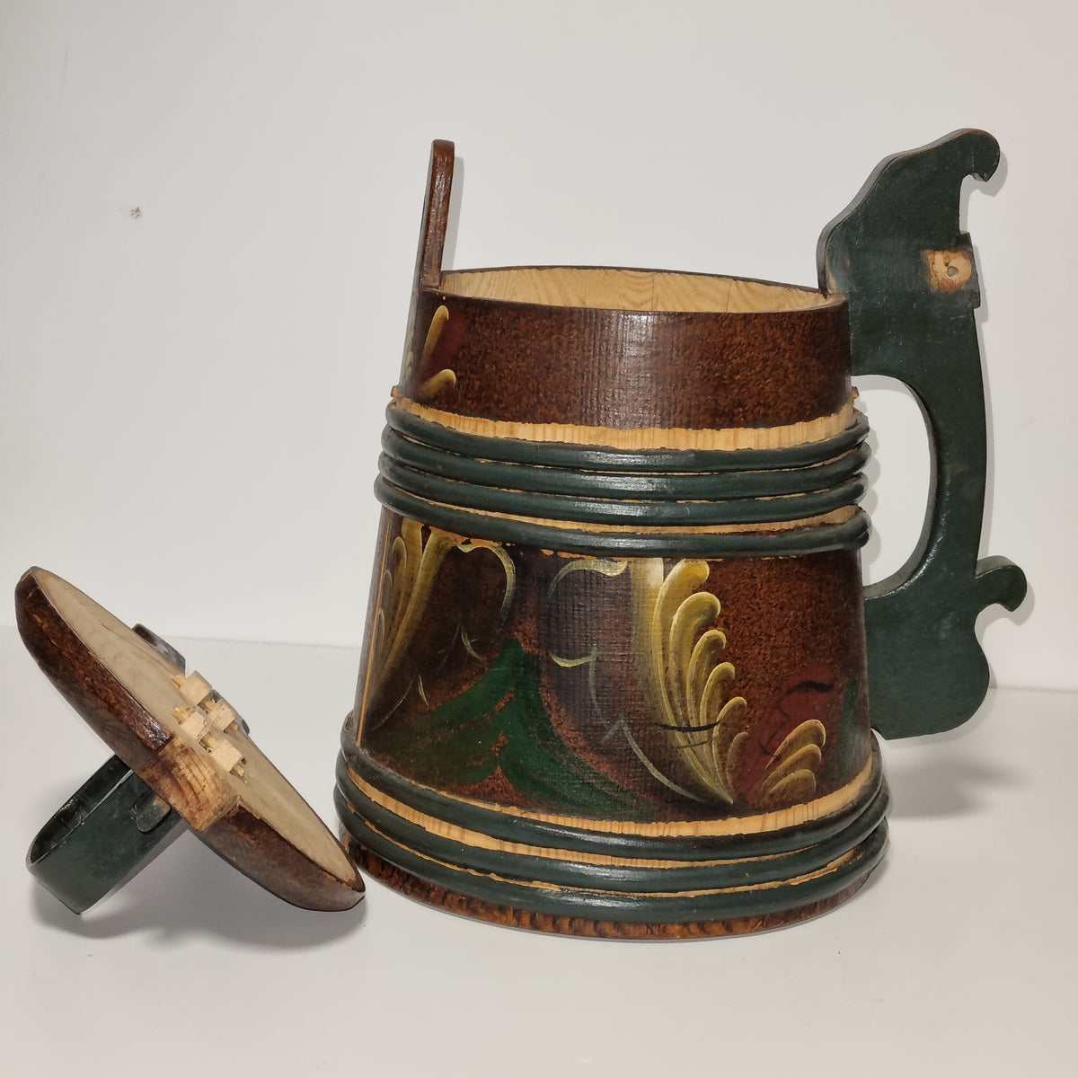 Rosemaling acanthus scrolls on staved wooden tankard, side view
