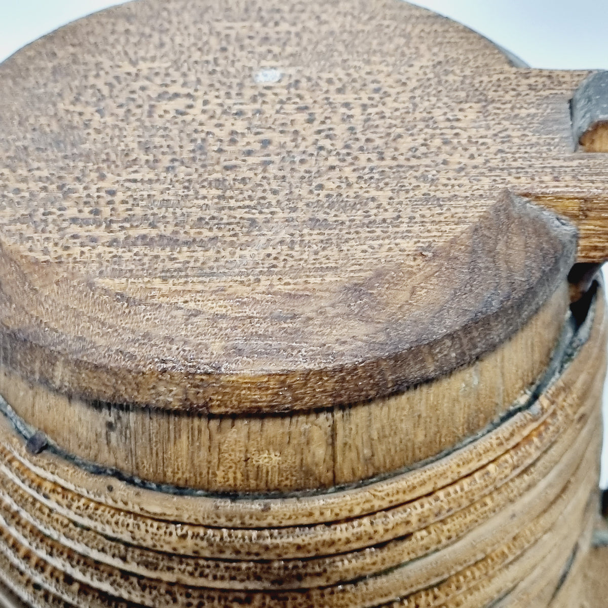 Close-up of split-branch hoops on Scandinavian wooden tankard