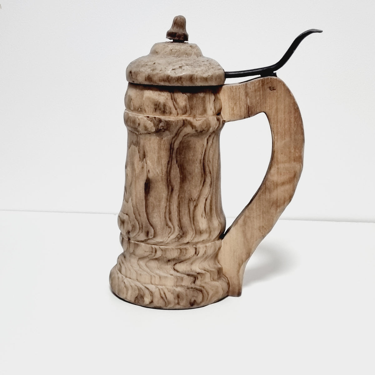 Hand carved wooden tankard with lid and iron lever, figured birch