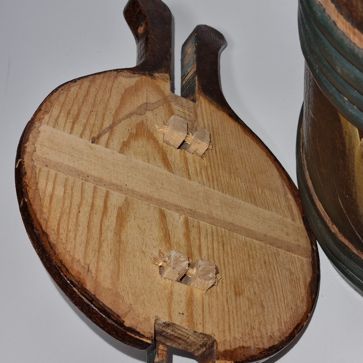 Detail of rosemaling tankard with sponged brown painted finish