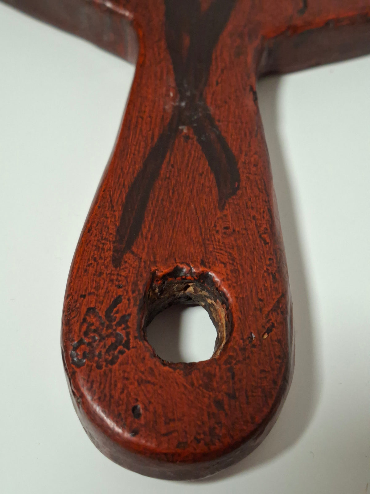 Handle with hanging hole on the antique Falu red bread board