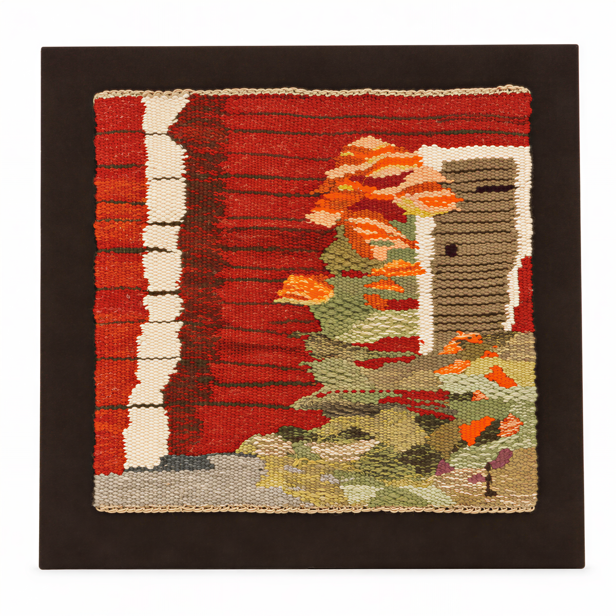 Swedish handwoven tapestry of a red cottage with orange flowers