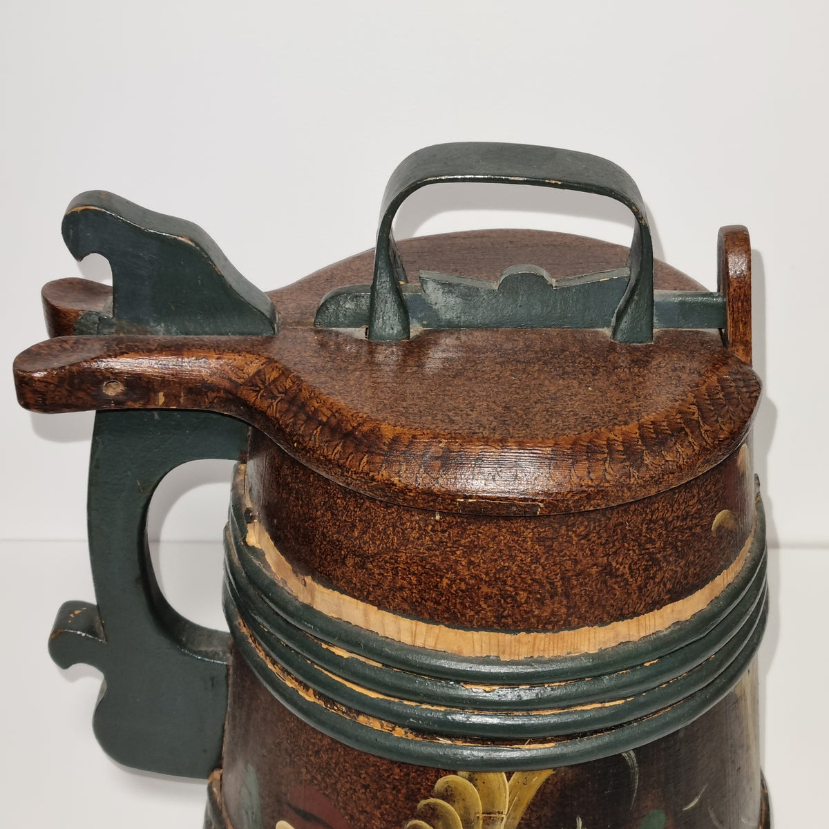 Hand painted rosemaling tankard with green handle and wooden hoops