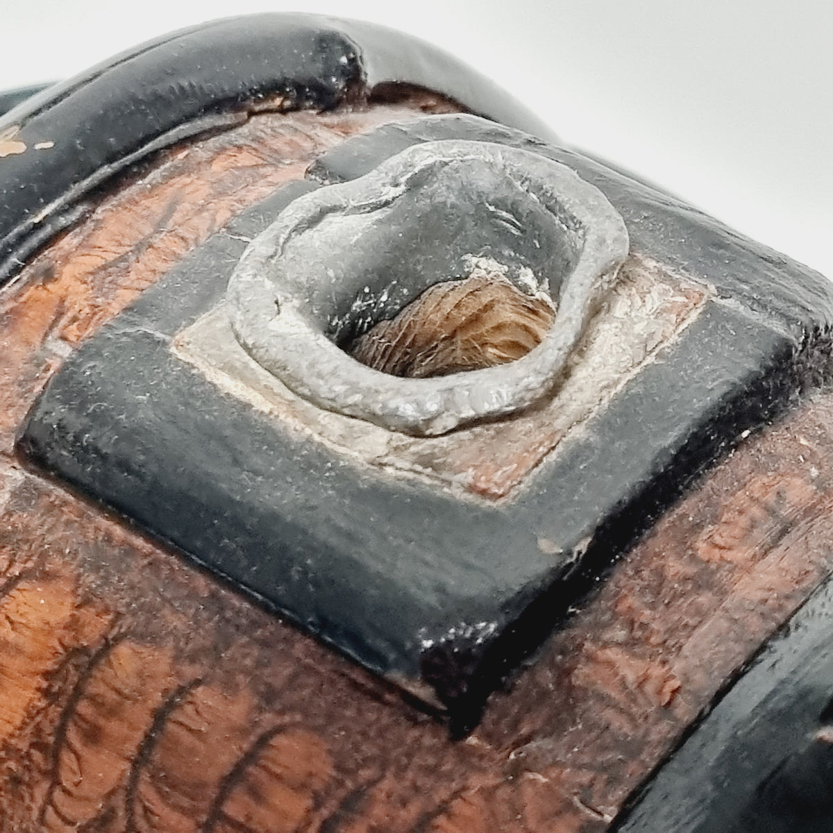 Pewter spout on top of antique staved wooden flask