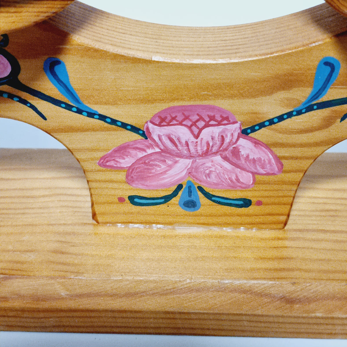 Hand painted pink rose at the center of Swedish advent candle holder
