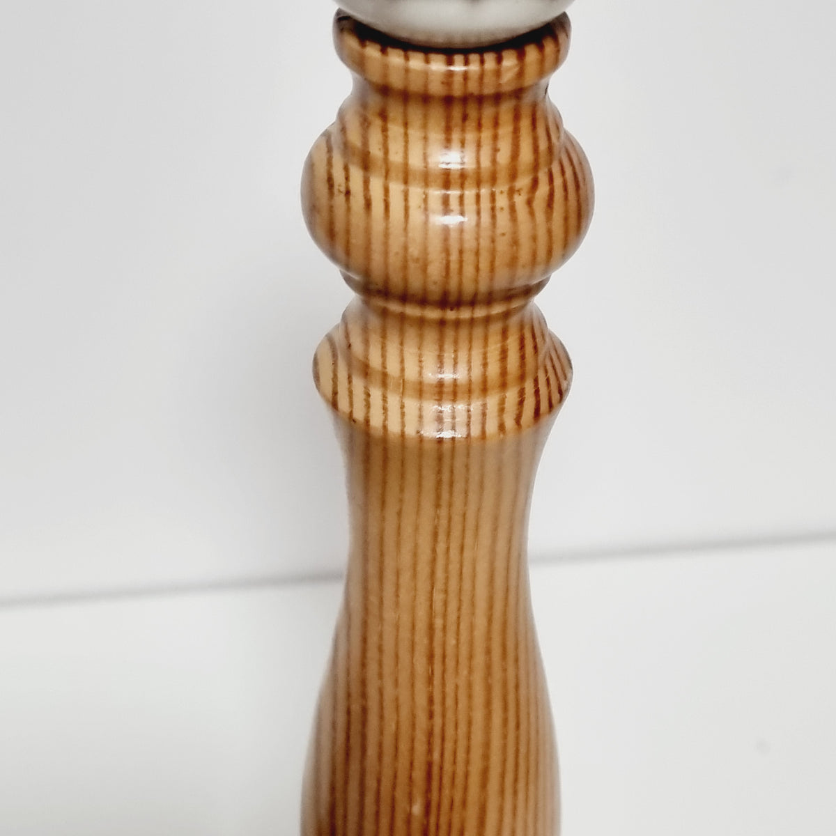 Close-up of turned rings on pine lamp stem