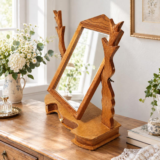 Solid honey pine tilting vanity mirror with carved branch supports
