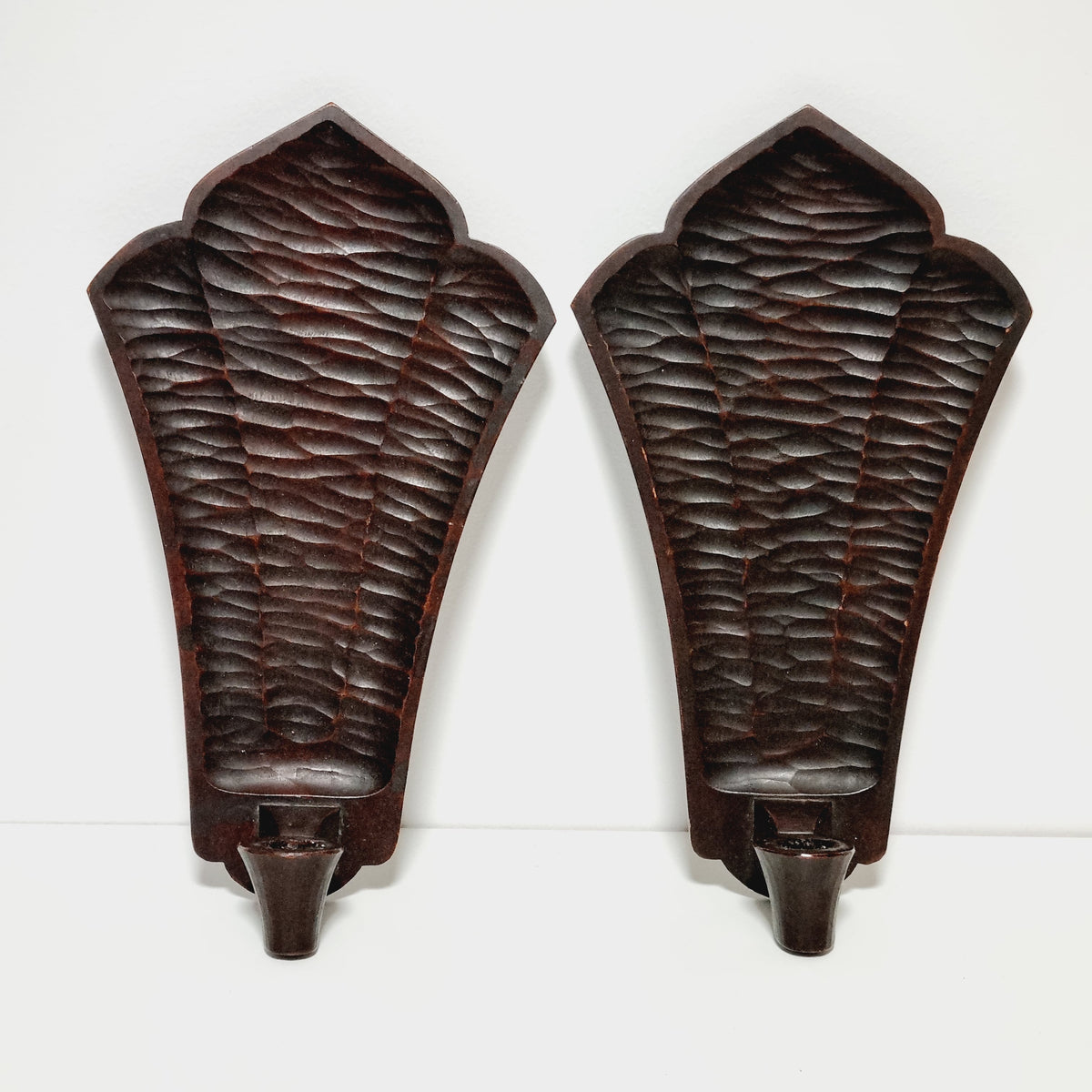 Hand faceted backs of Steneby carved wooden wall sconces